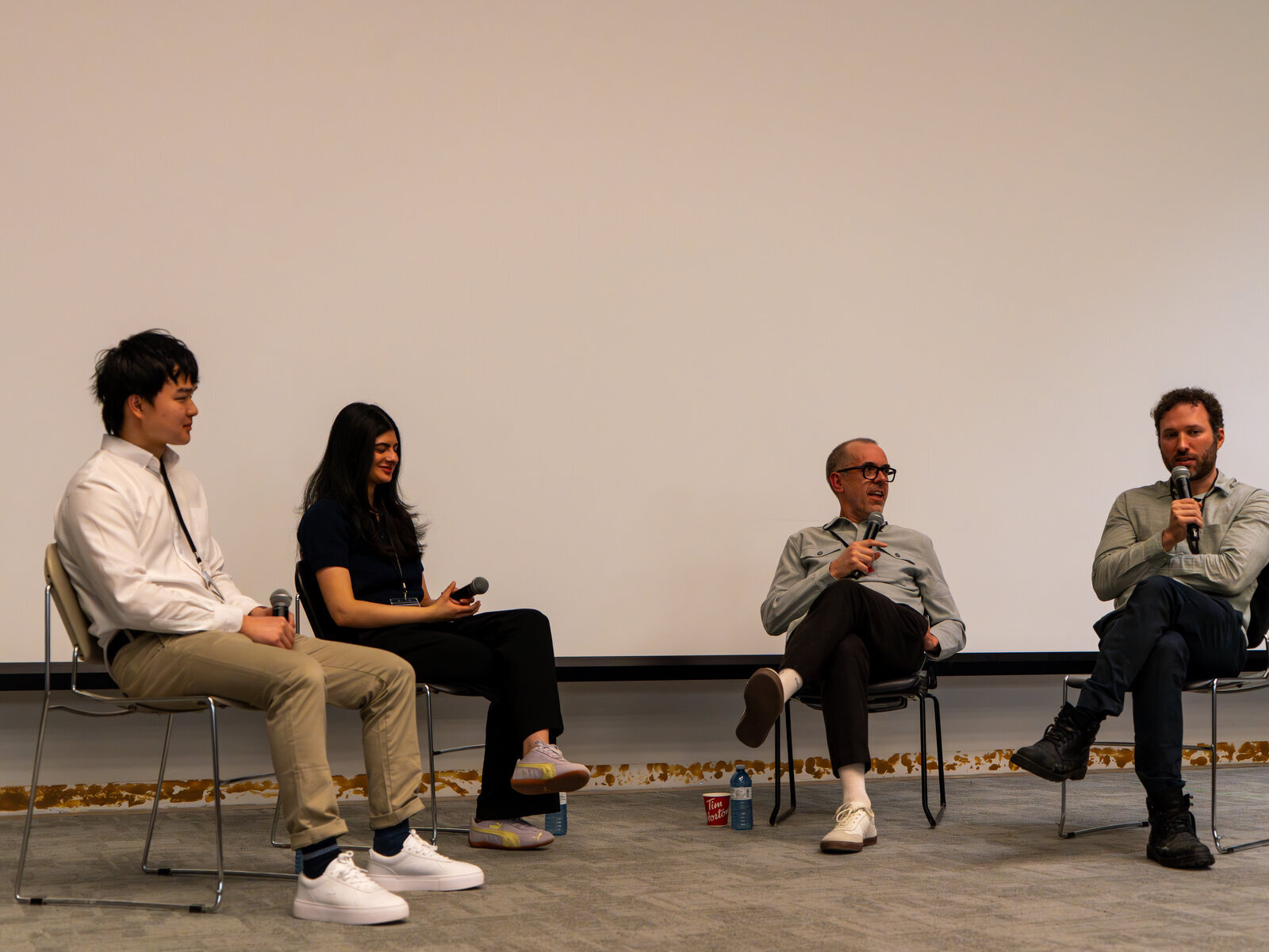 Panelists with microphones during the SAIL@UofT Q&A session.